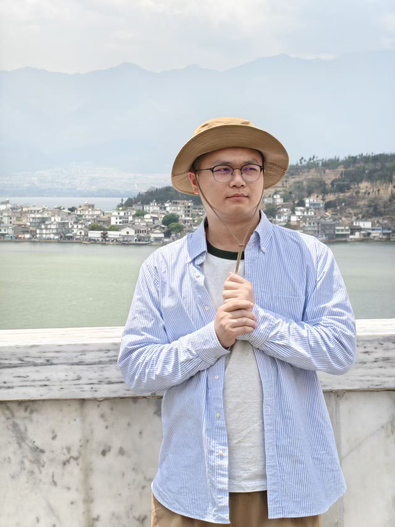 Leo standing near a mountain lake